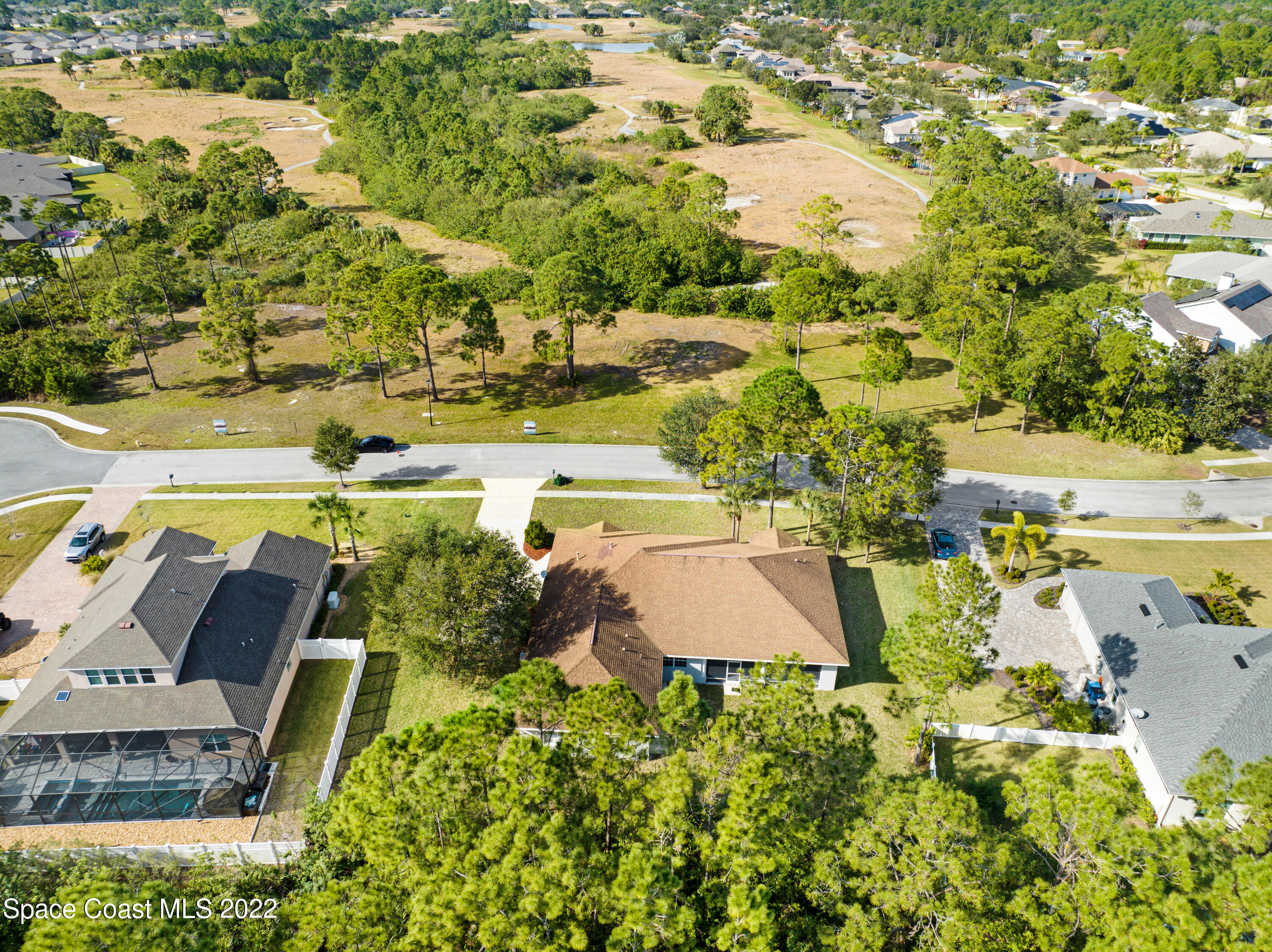 2185 Windbrook Drive Palm Bay, FL 32909 - Photo 7 of 61 an aerial view of house with yard swimming pool and outdoor seating