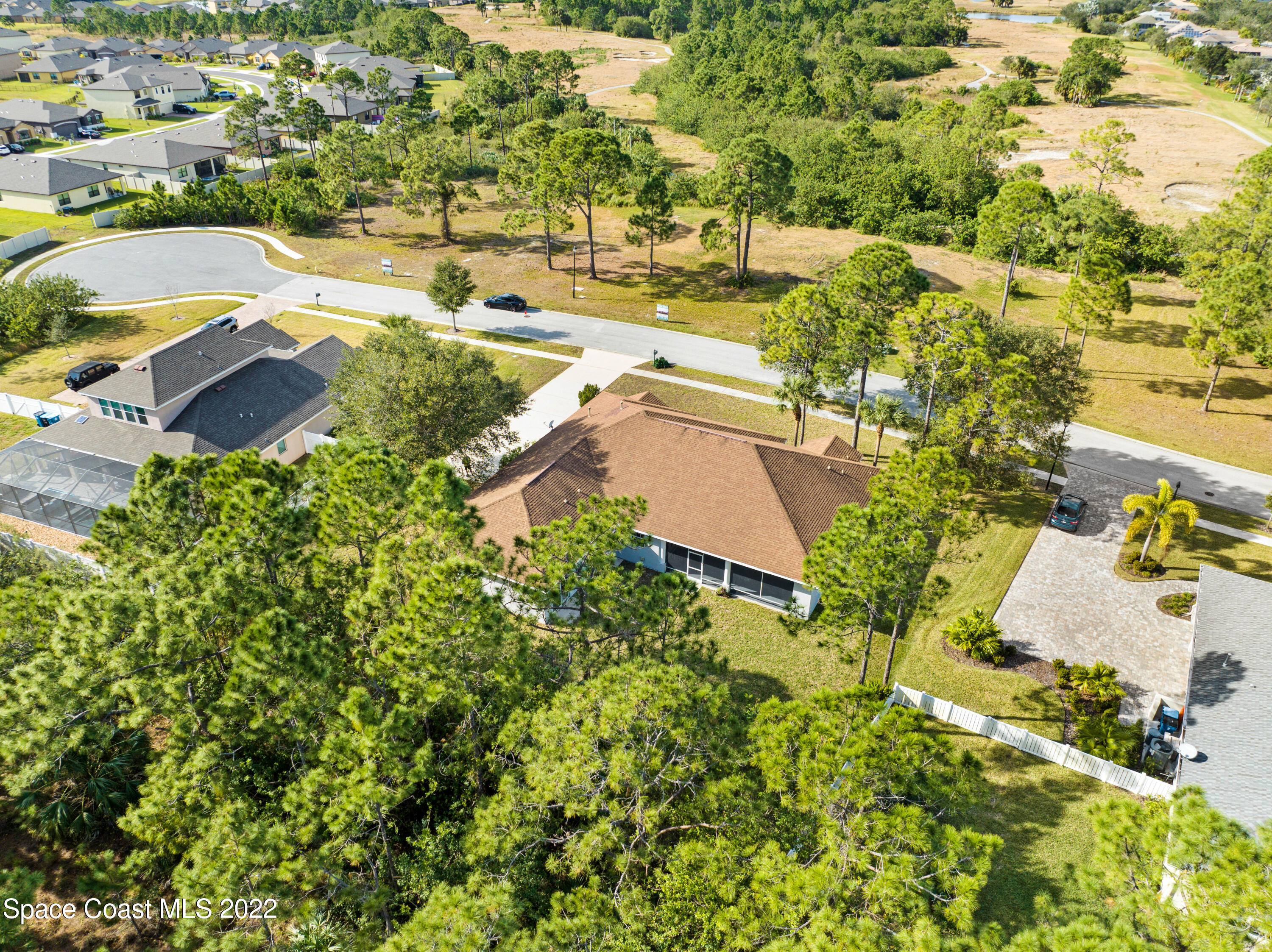 2185 Windbrook Drive Palm Bay, FL 32909 - Photo 9 of 61 an aerial view of residential houses with outdoor space