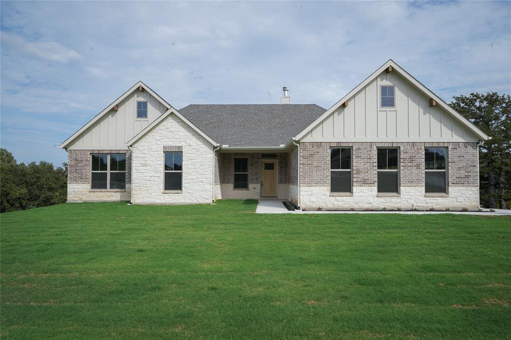 9020 Vly Oak Court Springtown, TX 76082 - Photo 1 of 1 a view of a house with a backyard