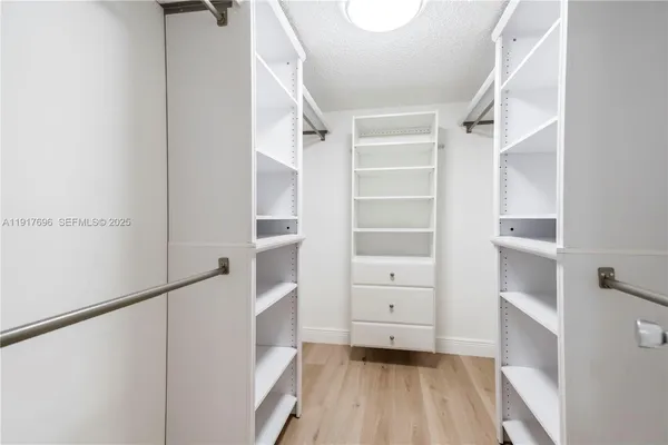 a kitchen with stainless steel appliances granite countertop a refrigerator stove and oven