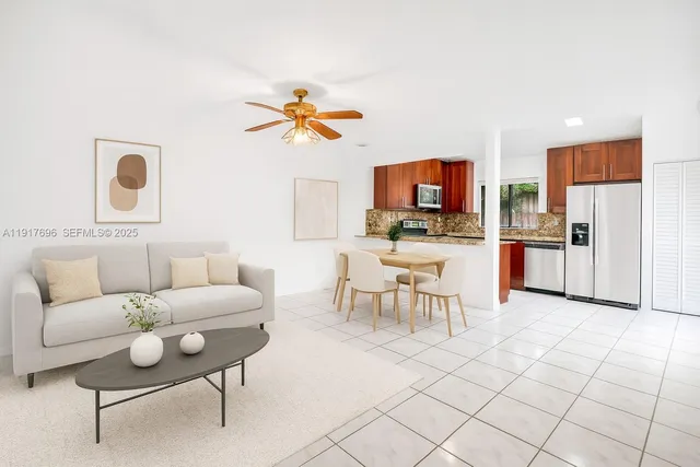 a kitchen with stainless steel appliances granite countertop a refrigerator stove and oven