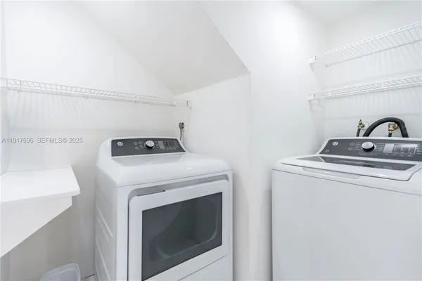 a view of empty room with fan