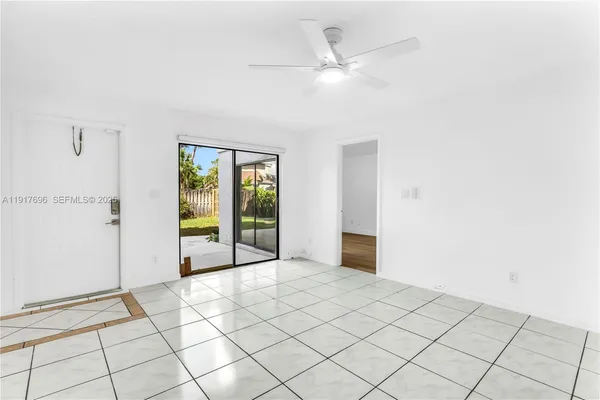 a view of an entryway with wooden floor