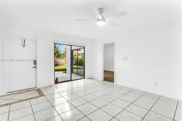 a view of an entryway with wooden floor