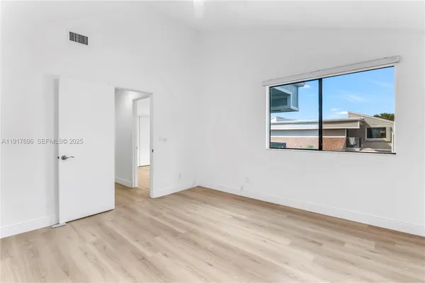 a bathroom with a shower and a toilet
