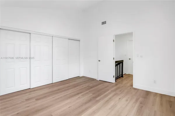an aerial view of a house with swimming pool and garden