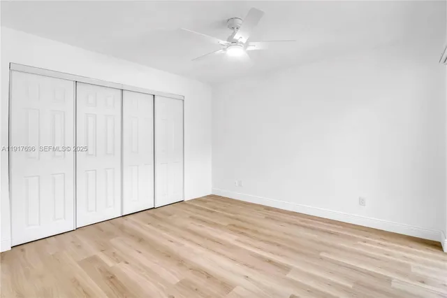 an aerial view of a house with swimming pool and garden