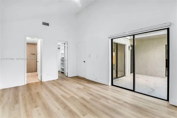 a living room with furniture a rug and a window