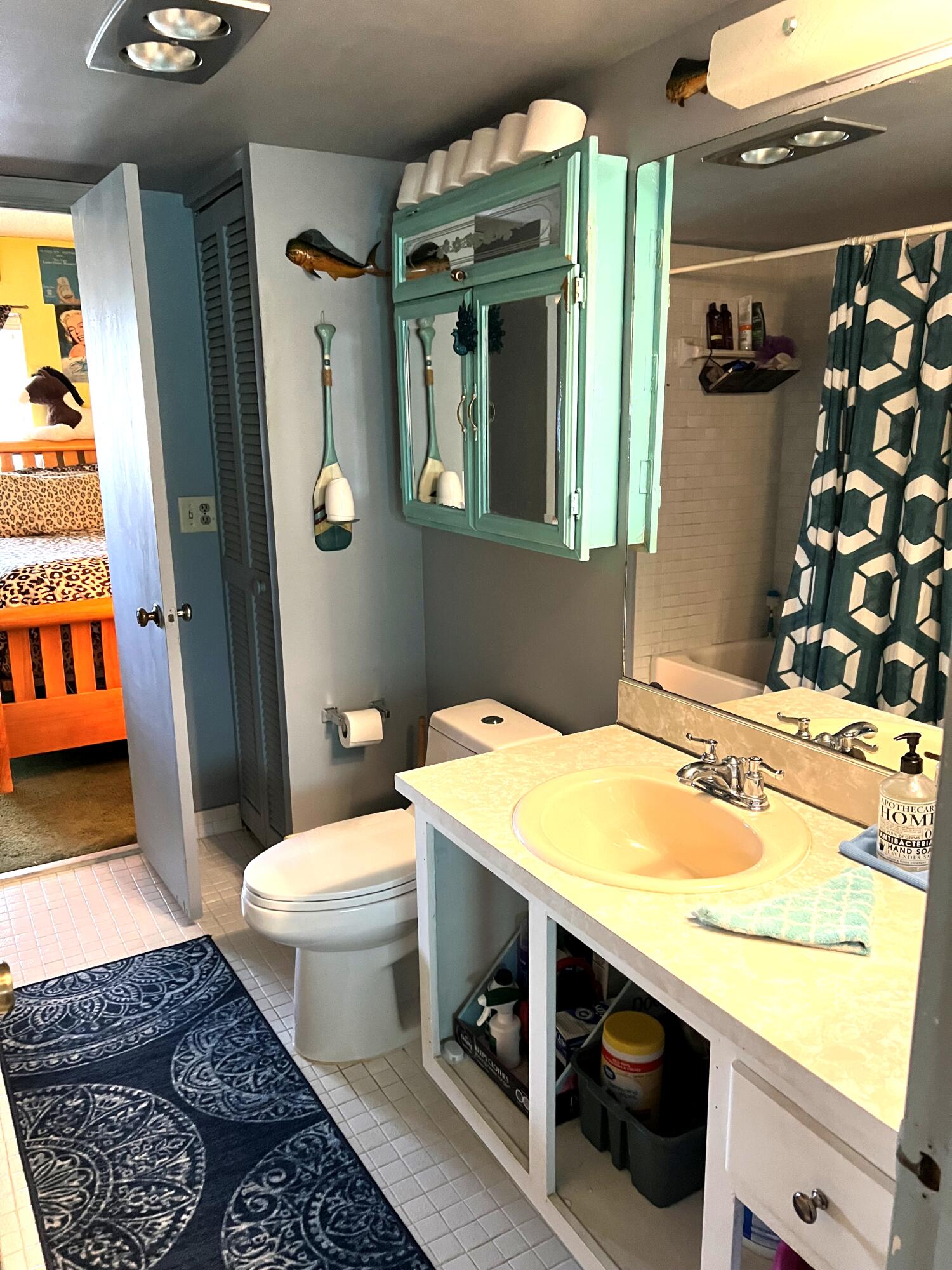 9855 Sandalfoot Boulevard, Unit 313 Boca Raton, FL 33428 - Photo 11 of 18 a bathroom with a sink a toilet and shower