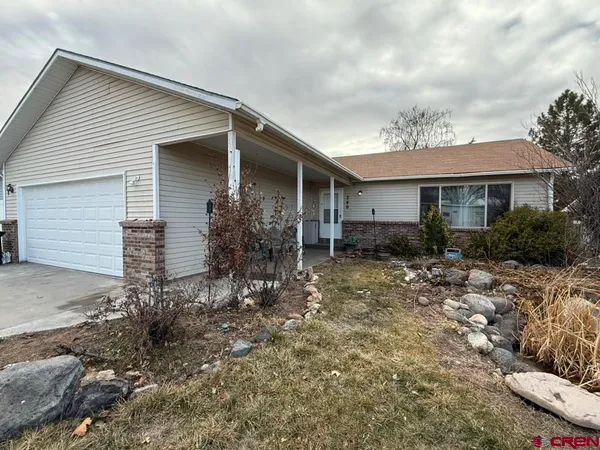 a view of a backyard of the house