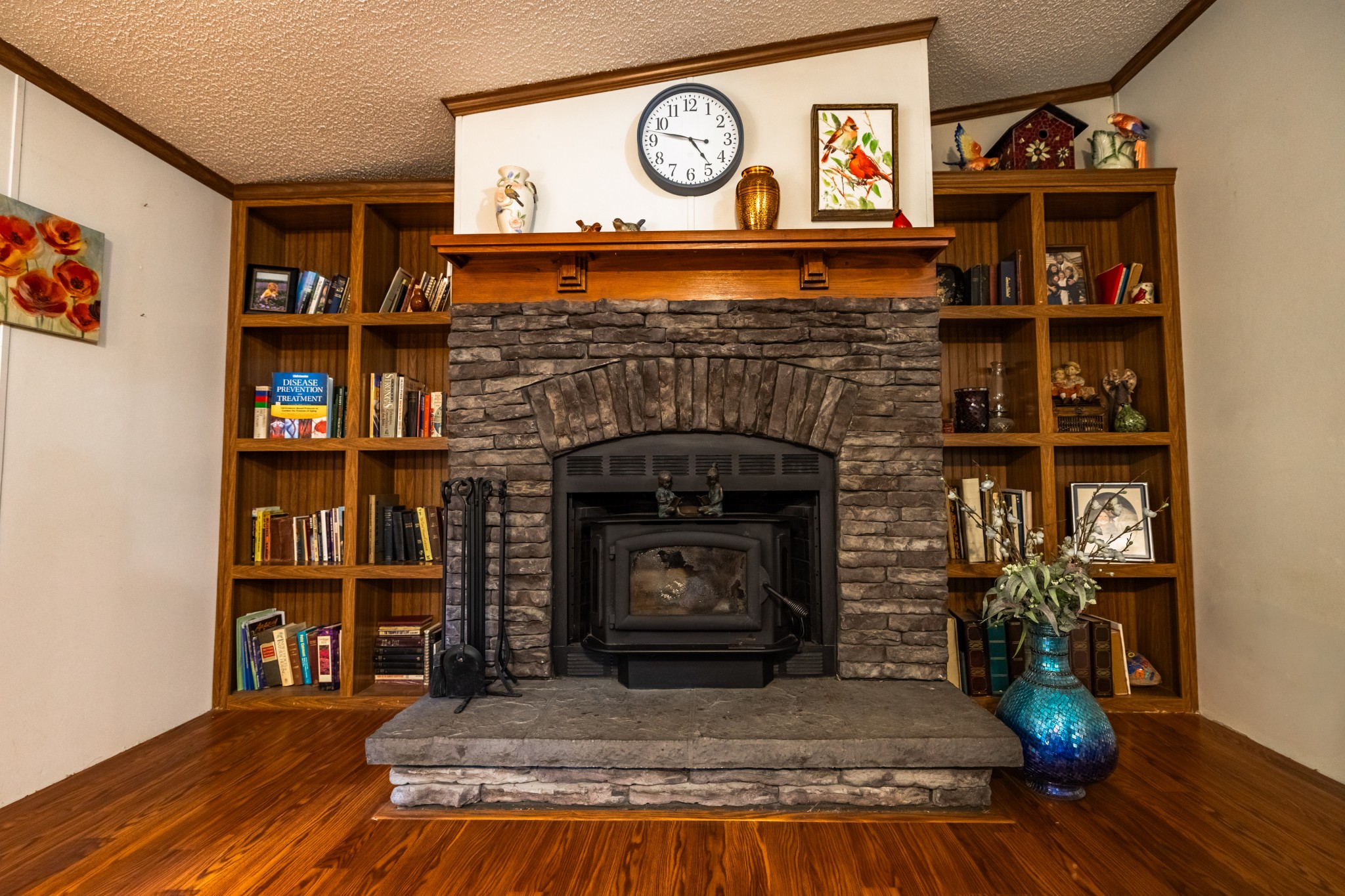 382 Locust Road Dunlap, TN 37327 - Photo 41 of 44 a living room with a fireplace and a wooden floor