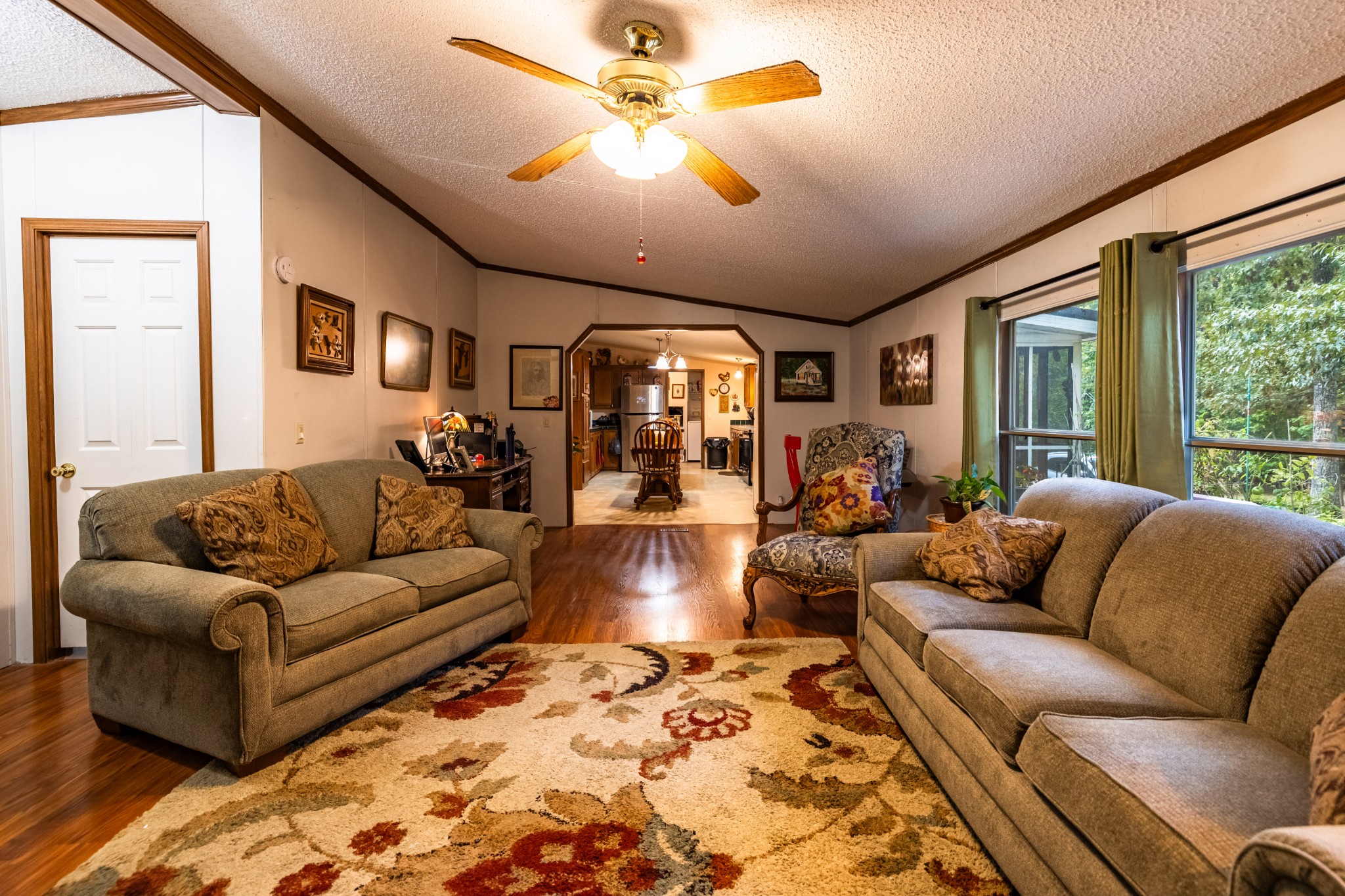 382 Locust Road Dunlap, TN 37327 - Photo 43 of 44 a living room with furniture ceiling fan and a rug