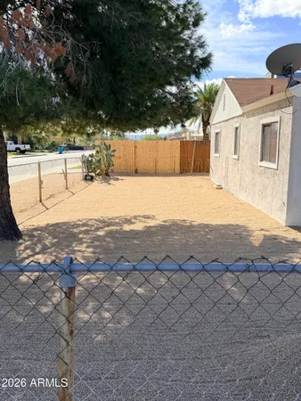 a view of a backyard of the house