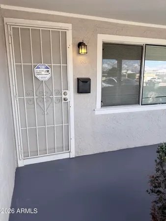a view of a door and a window