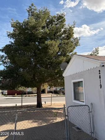 a sign board with a yard