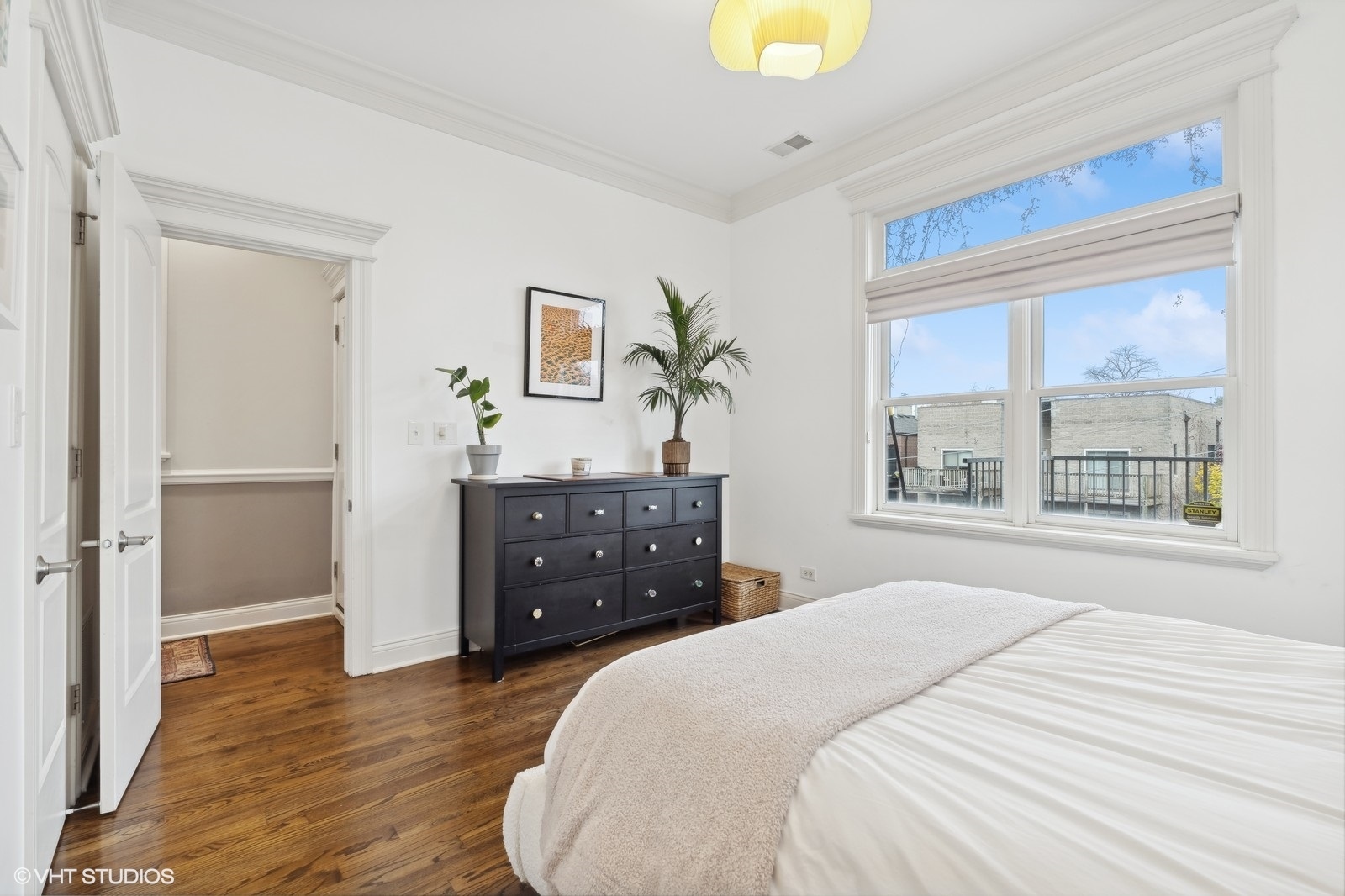3232 North Seminary Avenue, Unit 3 Chicago, IL 60657 - Photo 11 of 22 a bedroom with a bed and a dresser