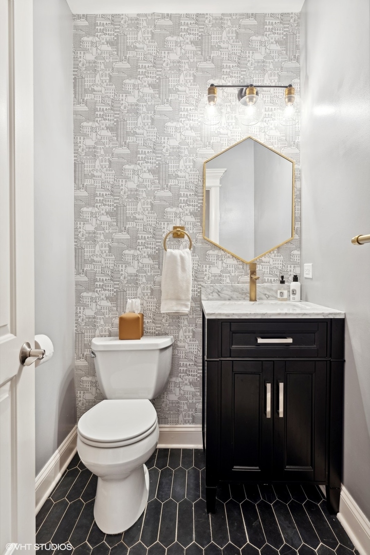 3232 North Seminary Avenue, Unit 3 Chicago, IL 60657 - Photo 15 of 22 a bathroom with a sink toilet and mirror