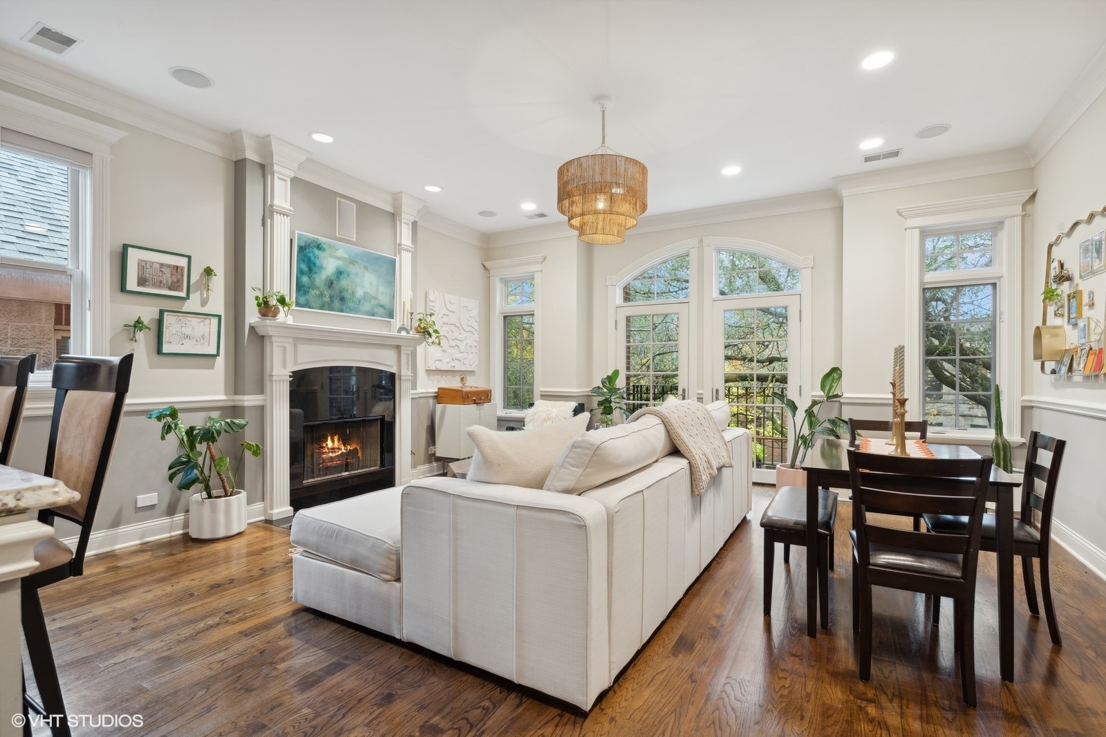3232 North Seminary Avenue, Unit 3 Chicago, IL 60657 - Photo 2 of 22 a living room with furniture a fireplace and a large window