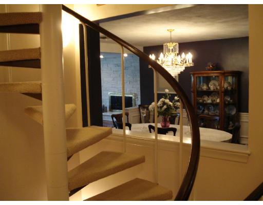 2 Nowers Road Lexington, MA 02420 - Photo 20 of 22 a view of a hallway with furniture and chandelier