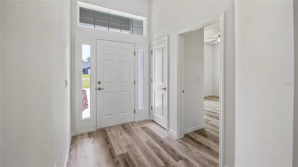 a view of a bathroom with wooden floor