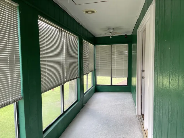 a bathroom with a sink a toilet and shower curtain