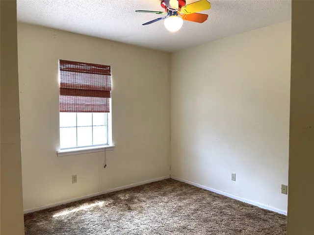 a view of a storage and utility room with a window