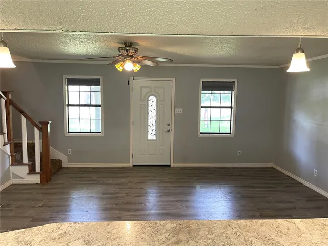 a kitchen with stainless steel appliances granite countertop a sink and a stove
