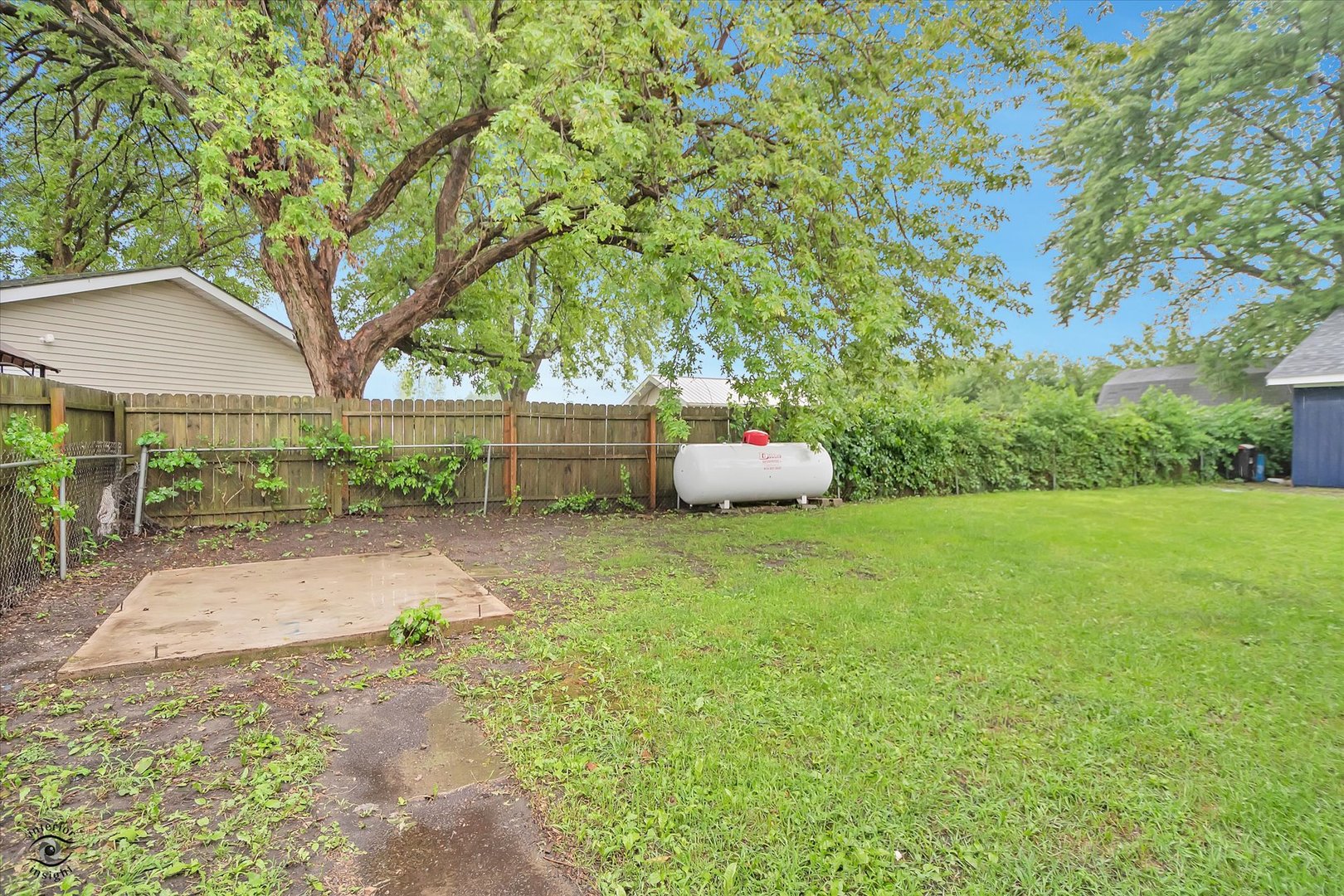 3032 West 9000N Road Manteno, IL 60950 - Photo 6 of 27 a view of a backyard with large trees and plants