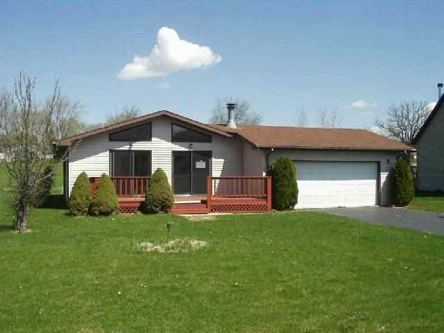 251 Lake Summerset Road Davis, IL 61019 - Photo 1 of 1 a front view of a house with a yard and garage