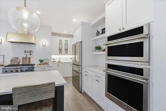 a kitchen with a stove and a microwave