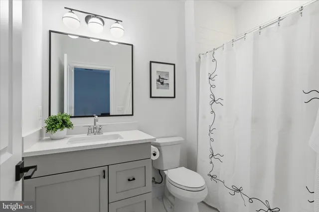 a bedroom with a bed and a table