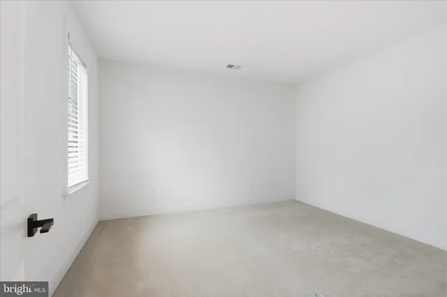 a bathroom with a sink a toilet and a large mirror