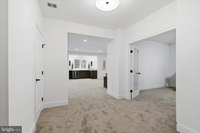 a living room with furniture and white walls