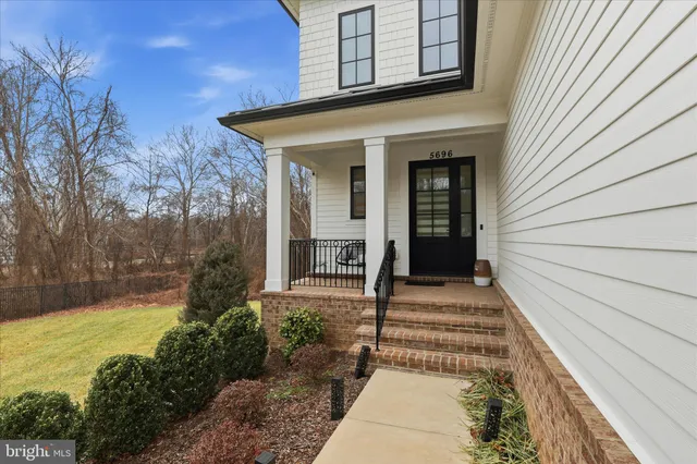 a front view of a house with a porch