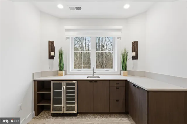 a bathroom with a sink a toilet and a large mirror