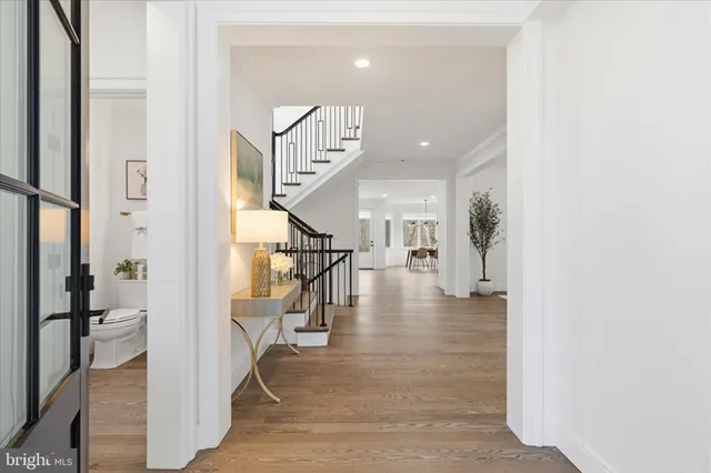 a view of entryway and hall with a living room