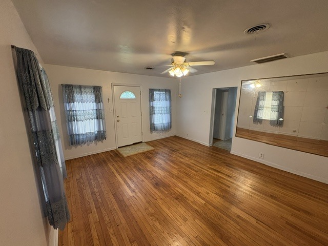 3S471 Pattermann Road Warrenville, IL 60555 - Photo 16 of 18 wooden floor in an empty room with a window