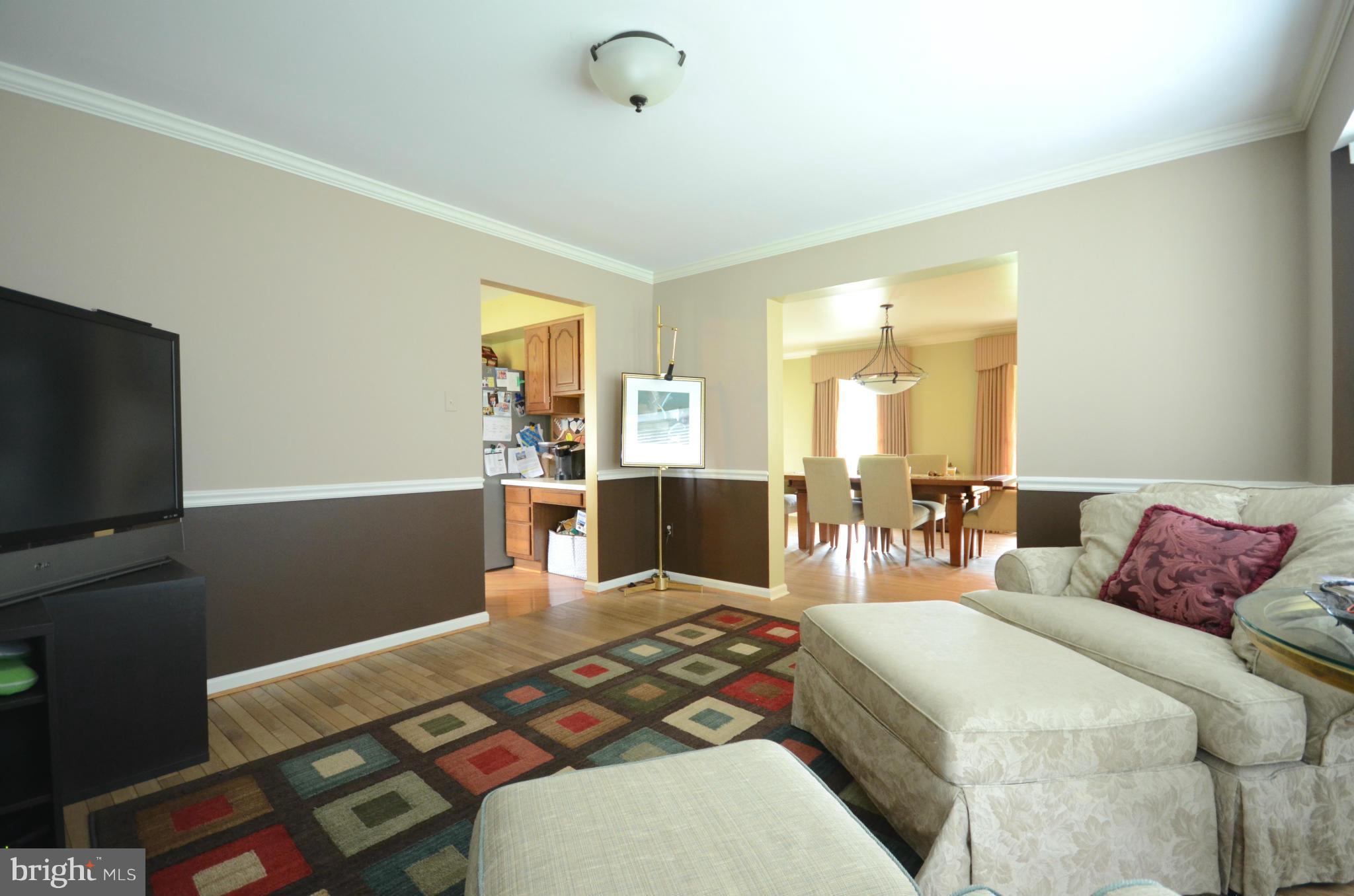 15931 York Road Sparks, MD 21152 - Photo 7 of 30 a bedroom with a bed and large windows