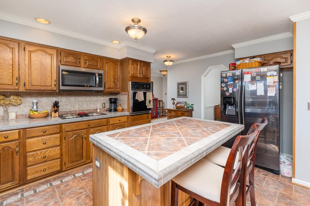 624 Augusta Farms Road Waynesboro, VA 22980 - Photo 23 of 63 a kitchen with stainless steel appliances granite countertop a sink microwave and cabinets