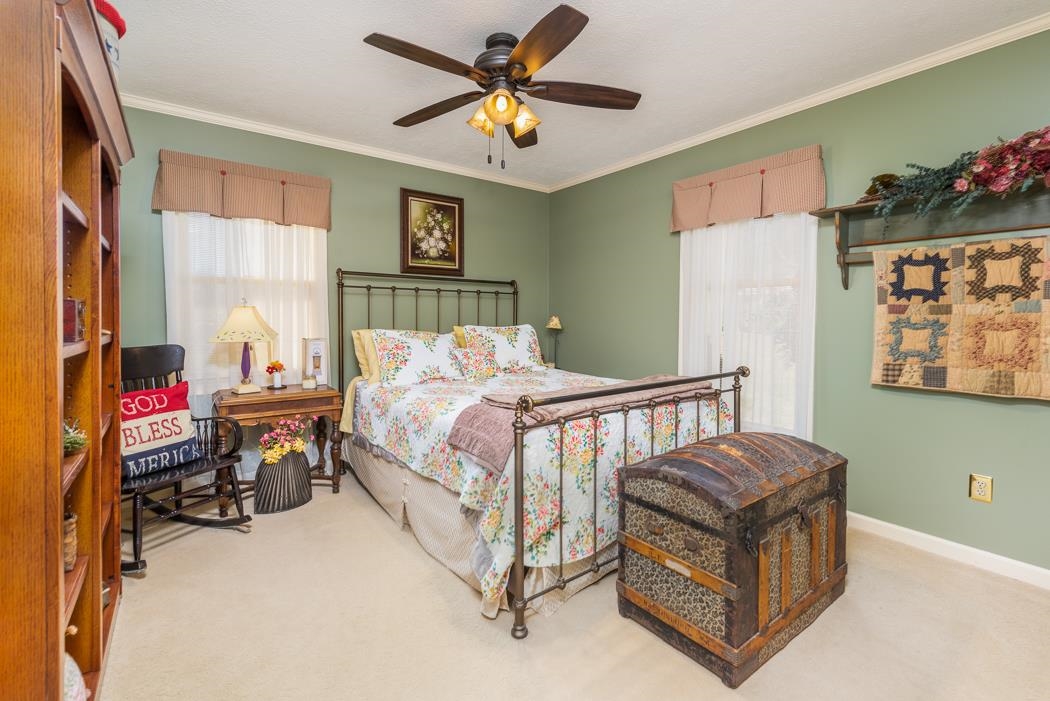 624 Augusta Farms Road Waynesboro, VA 22980 - Photo 36 of 63 a bedroom with furniture and a window