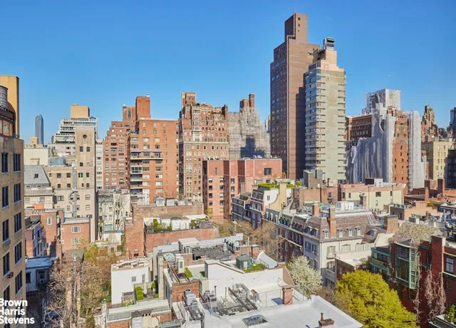 a bathroom with a toilet a sink and a mirror
