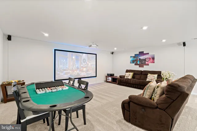 a spacious bedroom with a bed and a chandelier