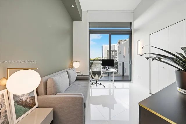 a living room with furniture and a mirror