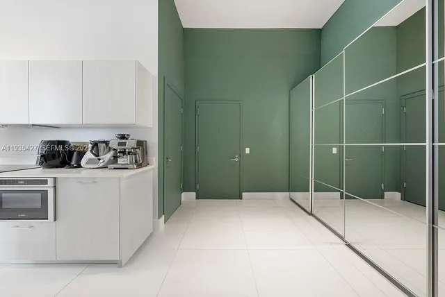 a bedroom with a bed and a sink