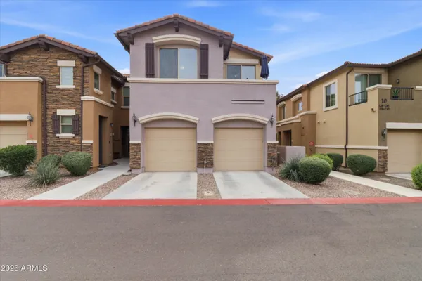 a front view of a house with yard