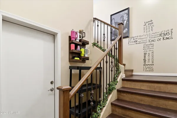 a view of entryway with wooden floor and stairs
