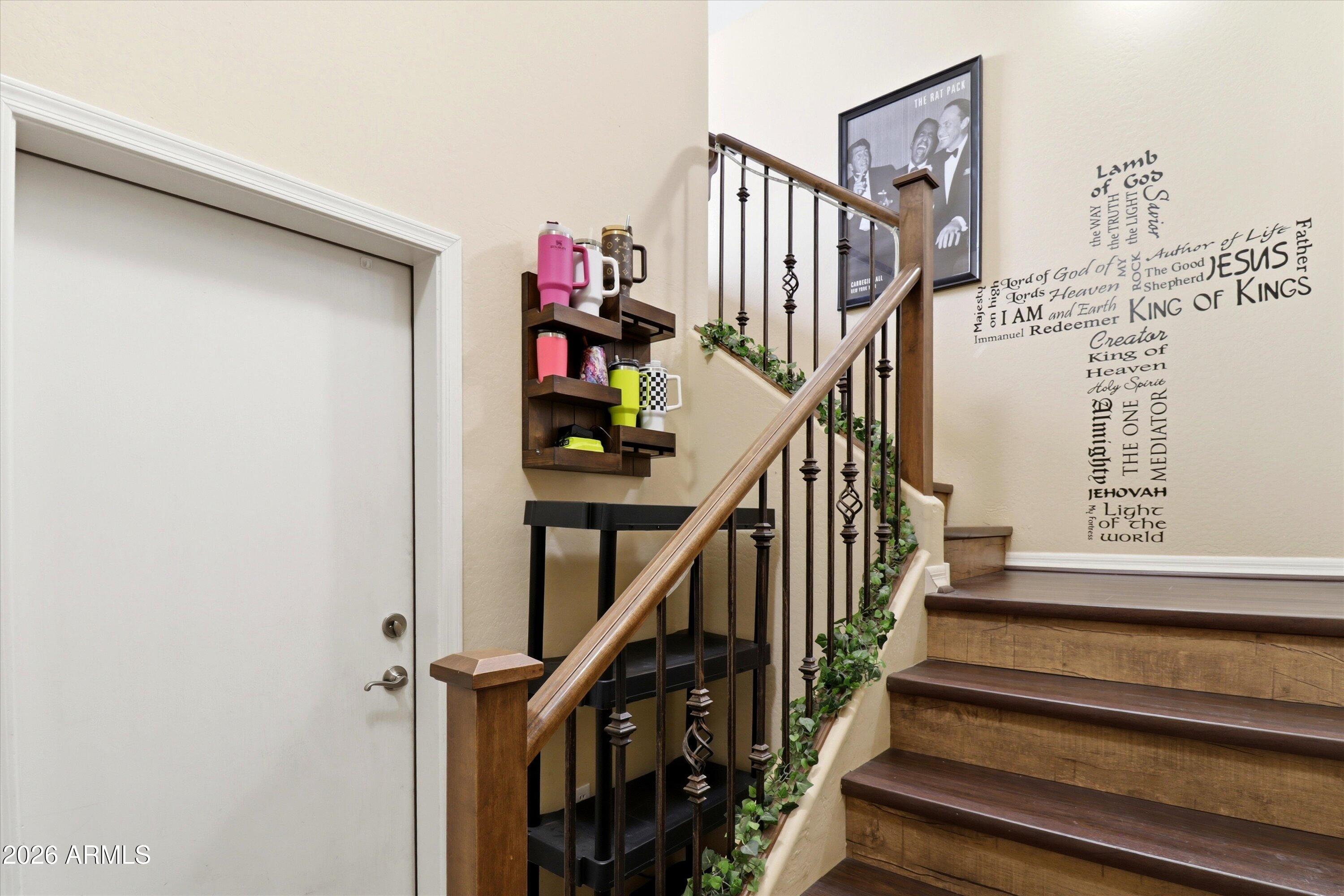 7726 East Baseline Road, Unit 227 Mesa, AZ 85209 - Photo 14 of 22 a view of entryway with wooden floor and stairs