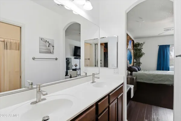 a bathroom with a sink and a mirror