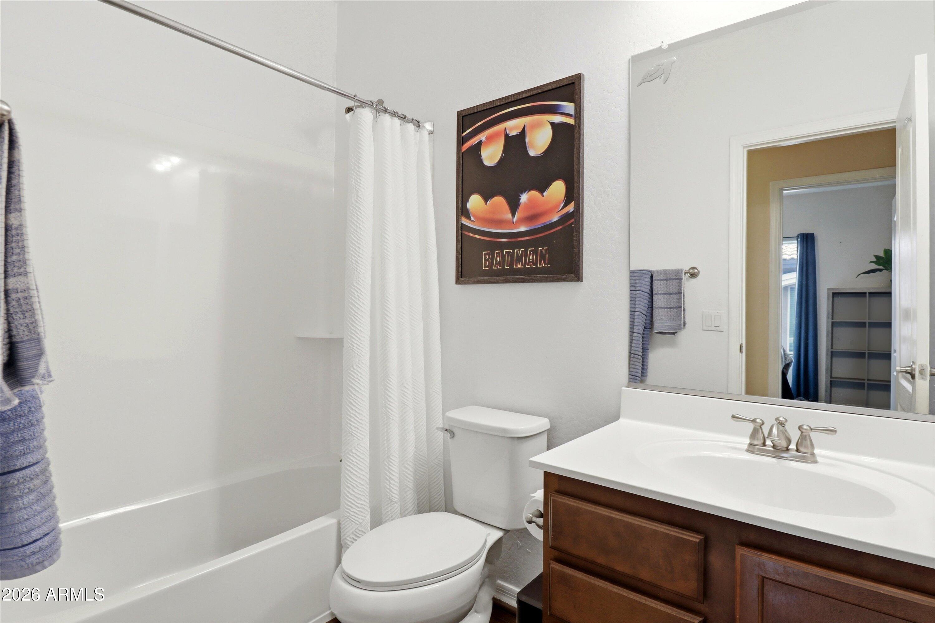 7726 East Baseline Road, Unit 227 Mesa, AZ 85209 - Photo 19 of 22 a bathroom with a toilet a sink and shower