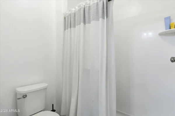 a bathroom with a shower curtain